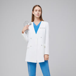 Image of Female doctor wearing a white double-breasted lab coat with embroidered name, styled with blue scrubs, showcasing a clean and professional look,White