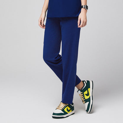 Admiral blue scrub pants with split hem, paired with green and yellow sneakers,Admirial Blue