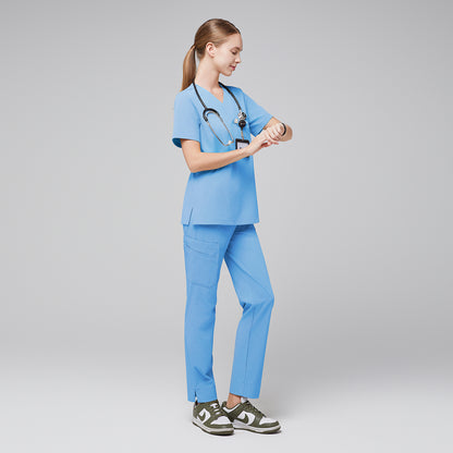 Female in light blue scrubs with a stethoscope, checking a smartwatch, paired with green and white sneakers,Aqua Blue