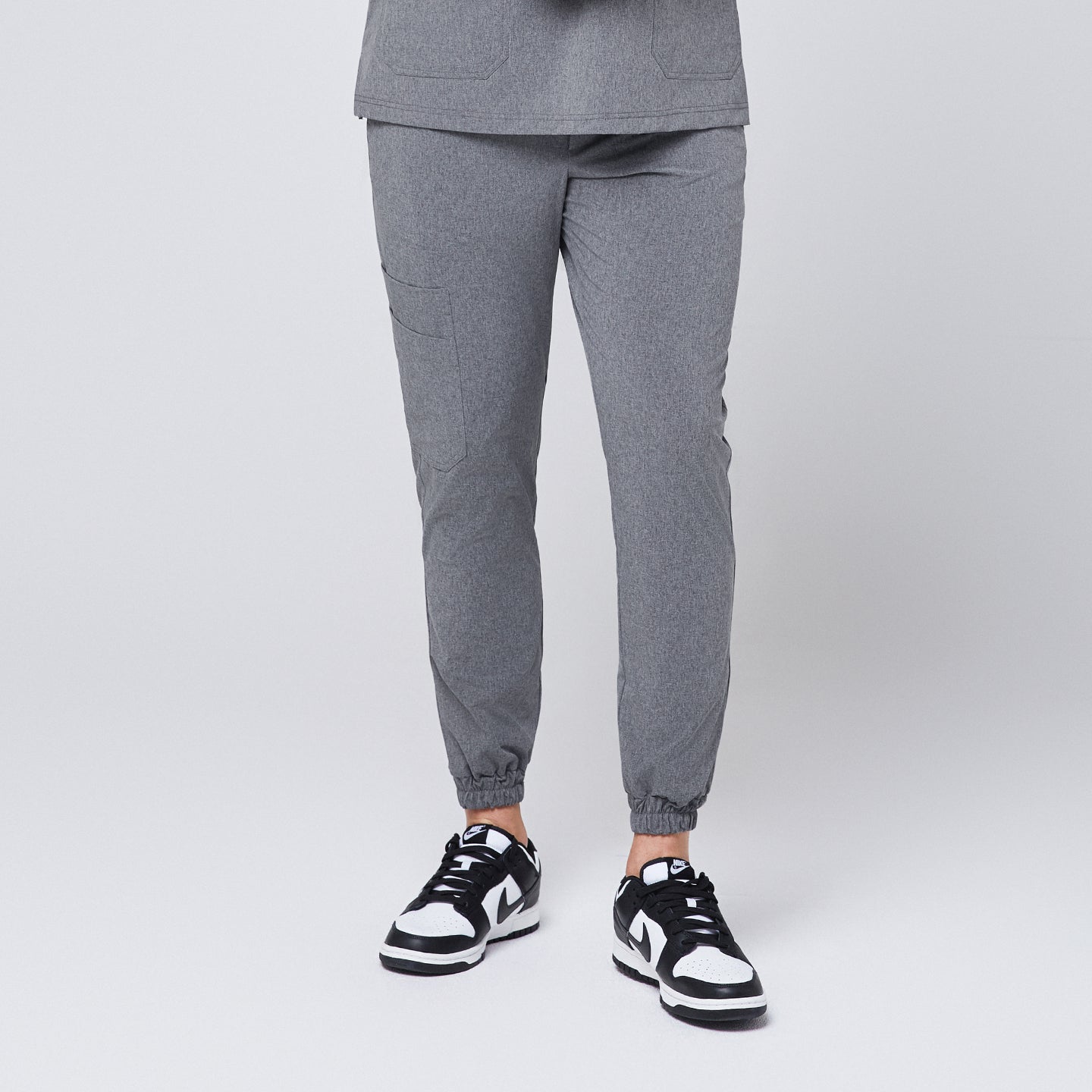 Close-up of Ash Gray StretchFit Jogger Scrub Pants, showing the elastic ankle cuff and a side pocket,Ash Gray