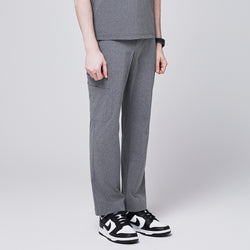 Image of Ash gray scrub pants with a straight-leg fit and side pocket, styled with black-and-white sneakers,Ash Gray