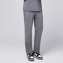 Image of Ash gray scrub pants featuring a straight-leg fit and a functional side pocket, paired with black-and-white sneakers,Ash Gray