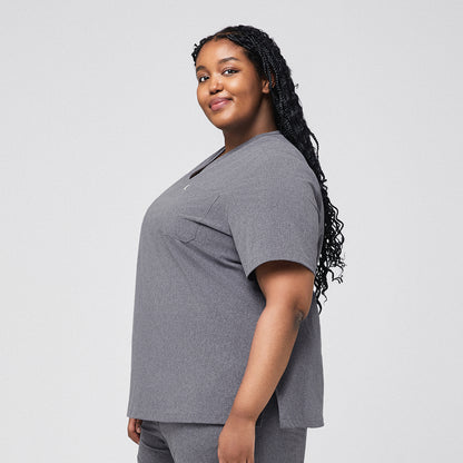 Healthcare worker in ash gray scrub top, side view, smiling,Ash Gray