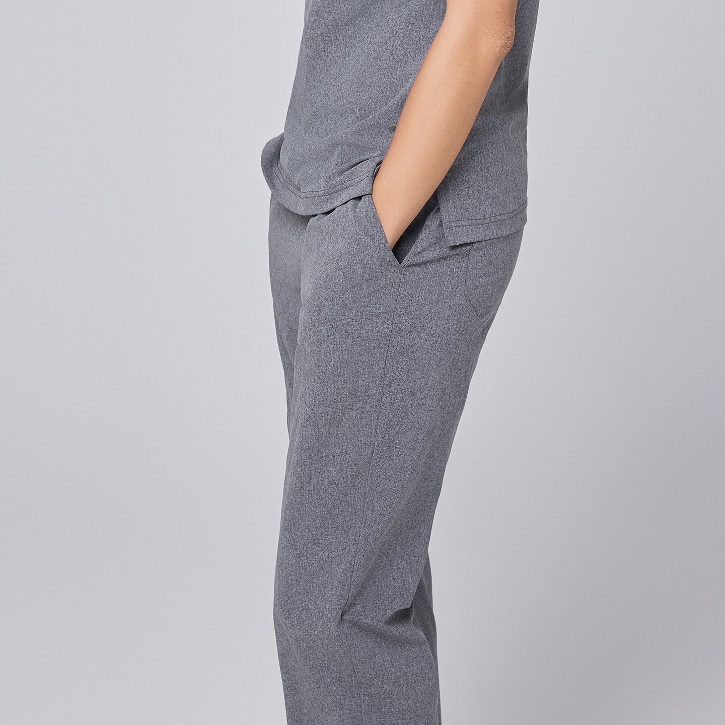 Side view of ash gray straight-leg scrub pants with a split hem and pockets, highlighting the clean and professional design,Ash Gray