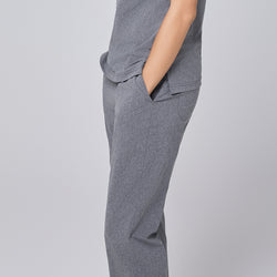 Image of Side view of ash gray straight-leg scrub pants with a split hem and pockets, highlighting the clean and professional design,Ash Gray