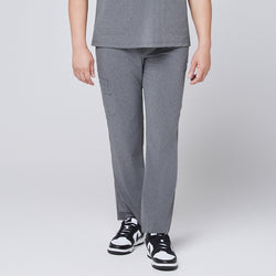 Image of Male model wearing ash gray relaxed-fit scrub pants with a straight-leg design, paired with black and white sneakers, showcasing a professional medical attire style,Ash Gray