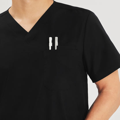Close-up of a scrub top chest pocket with two pens tucked in, Black