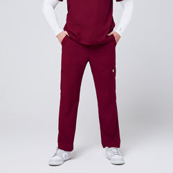 Image of Close-up of burgundy 8-pocket straight scrub pants paired with a matching scrub top and white sneakers,Burgundy