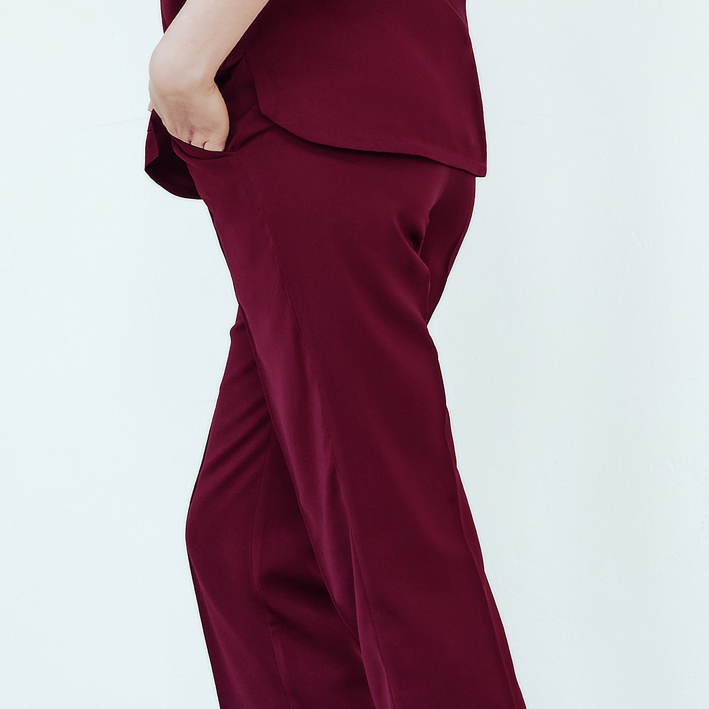  Burgundy Line Banding Scrub Pants, back view, showcasing the side pocket detail and smooth fabric finish, paired with a matching top,Burgundy