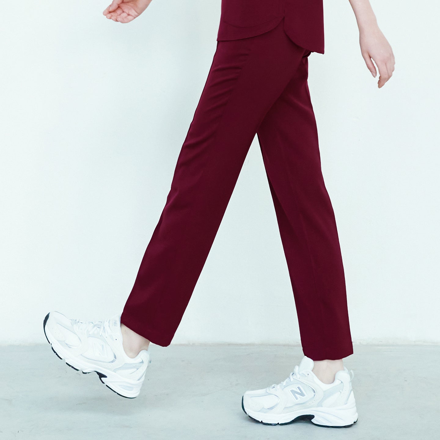 Burgundy Line Banding Scrub Pants, side view, highlighting the rich color and comfortable fit, paired with white sneakers,Burgundy