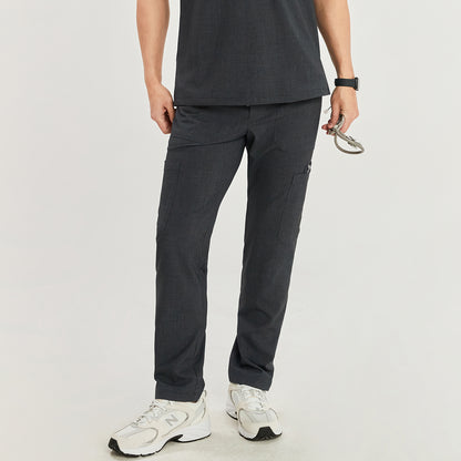  Model wearing straight scrub pants with zipper details and side pockets, paired with a V-neck scrub top and white sneakers, holding a medical tool,Charcoal Gray