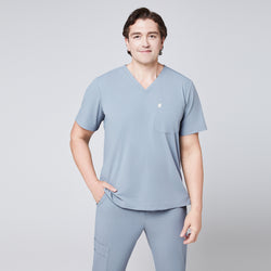 Image of Man wearing a cool gray scrub set with a single-pocket V-neck top, designed for medical professionals,Cool Gray