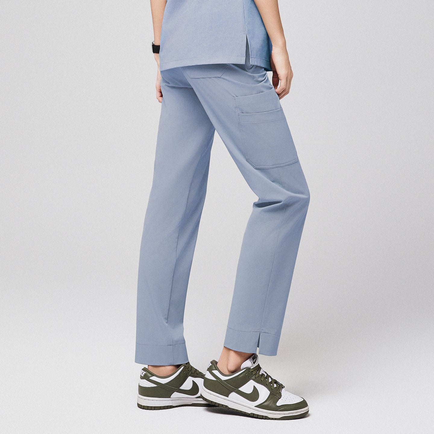 Cool gray straight scrub pants with split hem, side pocket, and paired with green and white sneakers,Cool Gray