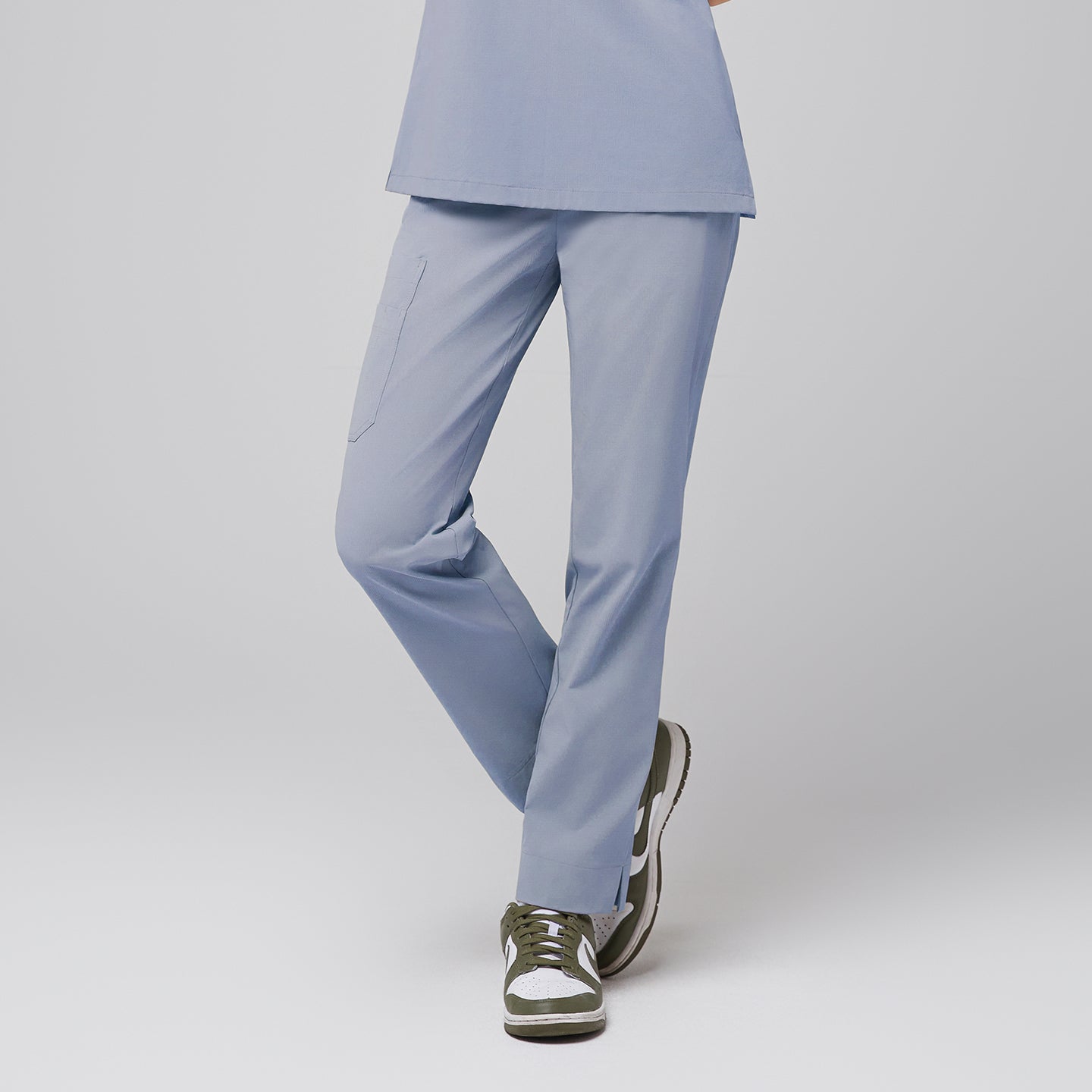 Cool gray scrub pants with pocket and split hem, paired with green and white sneakers,Cool Gray