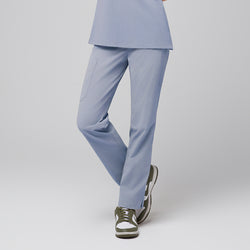 Image of Cool gray scrub pants with pocket and split hem, paired with green and white sneakers,Cool Gray