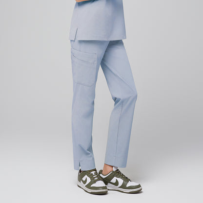 Side view of cool gray scrub pants with side pocket and split hem, paired with green and white sneakers,Cool Gray