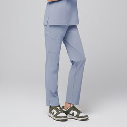 Image of Side view of cool gray scrub pants with side pocket and split hem, paired with green and white sneakers,Cool Gray