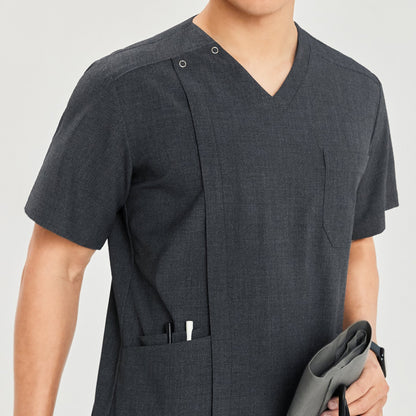 Close-up of front zipper scrub top showing chest and side pockets, with pens and a blood pressure monitor in hand,Charcoal Gray