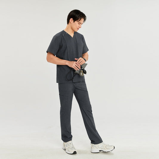 Man in charcoal gray front zipper scrub top with matching cargo pants, holding a blood pressure monitor,Charcoal Gray