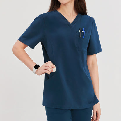 Close-up of a woman wearing a dark blue soft stretch scrub top, showing the chest pocket with pens and side pocket details, with a smartwatch on her wrist,Dark Blue