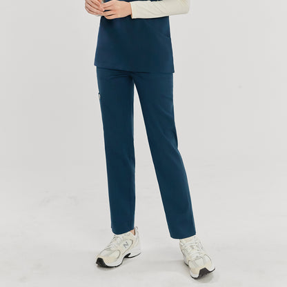 Woman wearing dark blue split hem scrub pants, showing the front view. She is clasping her hands together,Dark Blue