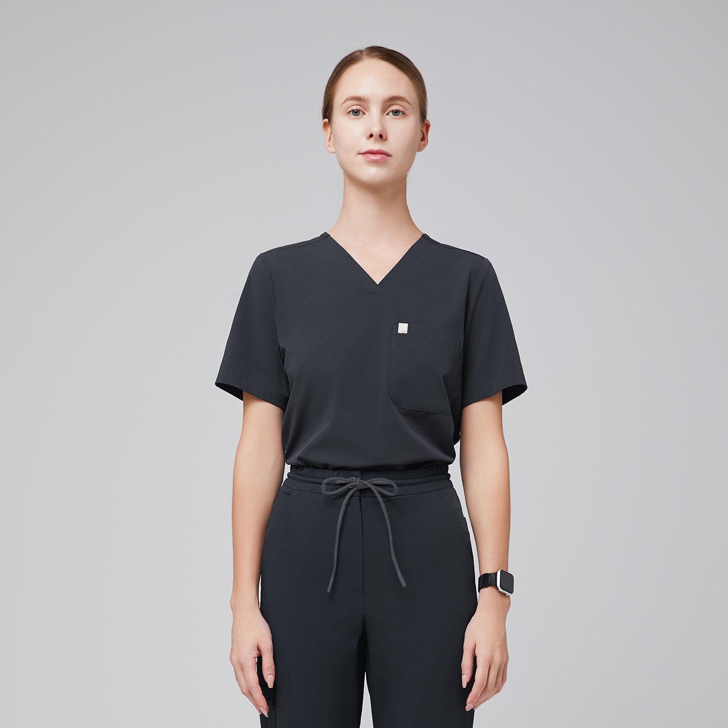 Deep gray V-neck scrub top with a single chest pocket, paired with drawstring scrub pants for a professional medical uniform,Deep Gray