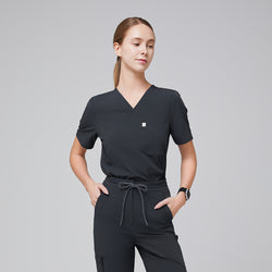 Image of Half-side view of deep gray V-neck scrub top with a single chest pocket, paired with drawstring scrub pants for a sleek medical uniform,Deep Gray