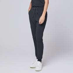 Image of Deep gray jogger scrub pants with drawstring waistband and elastic cuffs, paired with white sneakers,Deep Gray