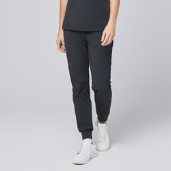 Image of Deep gray jogger scrub pants with zipper pocket and elastic cuffs, paired with white sneakers,Deep Gray