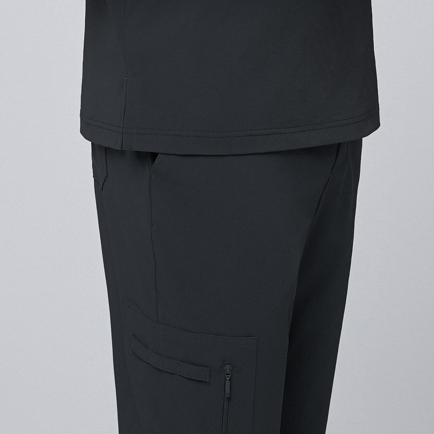 Close-up detail of deep gray straight scrub pants featuring a side zipper pocket, showcased with precise stitching and smooth fabric texture,Deep Gray