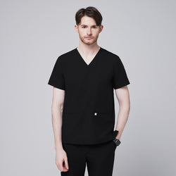 Image of Man wearing black scrubs with a V-neck and double pockets, standing with a neutral expression,Eco Black