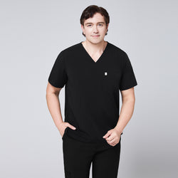 Image of Man in a black scrub set with a single-pocket V-neck top and relaxed fit pants,Eco Black