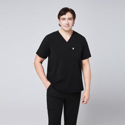 Image of Man wearing a black scrub set with a single-pocket V-neck top, designed for healthcare professionals,Eco Black