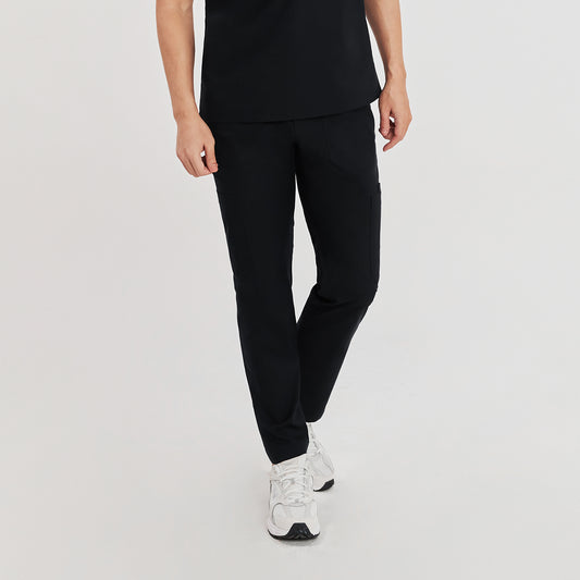 Model wearing zipper straight scrub pants with a straight fit and multiple pockets, paired with a black top and white sneakers,Eco Black
