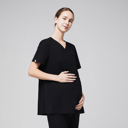 Pregnant healthcare professional in black maternity scrub top, holding her belly,Eco Black