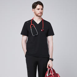 Image of Man wearing Zenir black shoulder button scrub top with a red stethoscope and holding a red duffle bag,Eco Black