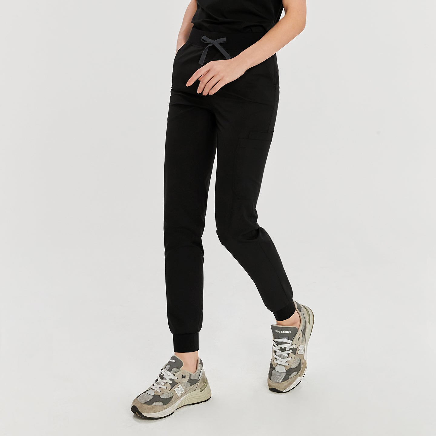 Eco-friendly black jogger scrub pants with front pockets, featuring a gray drawstring for a comfortable fit and practical style,Eco Black