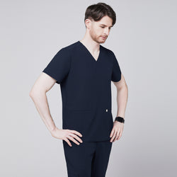 Image of Men's navy blue scrub top with V-neck and double pockets, paired with matching navy pants,Eco Navy