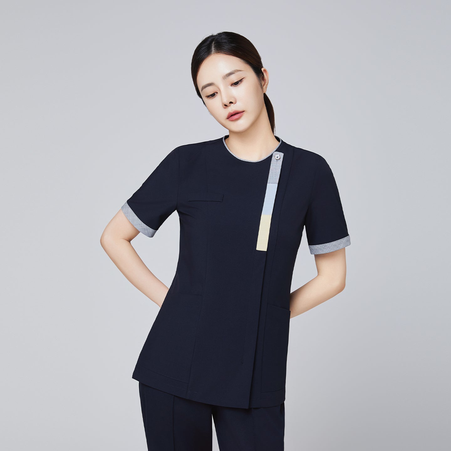 Navy scrub top with short sleeves and triple-tone accents, featuring a front zipper and sleek professional design,Eco Navy