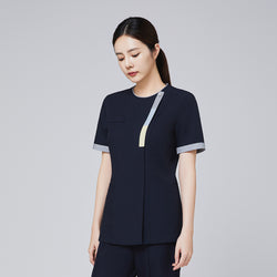 Image of Professional navy scrub top with triple-tone detailing on the front zipper and sleeves, modeled by a woman,Eco Navy