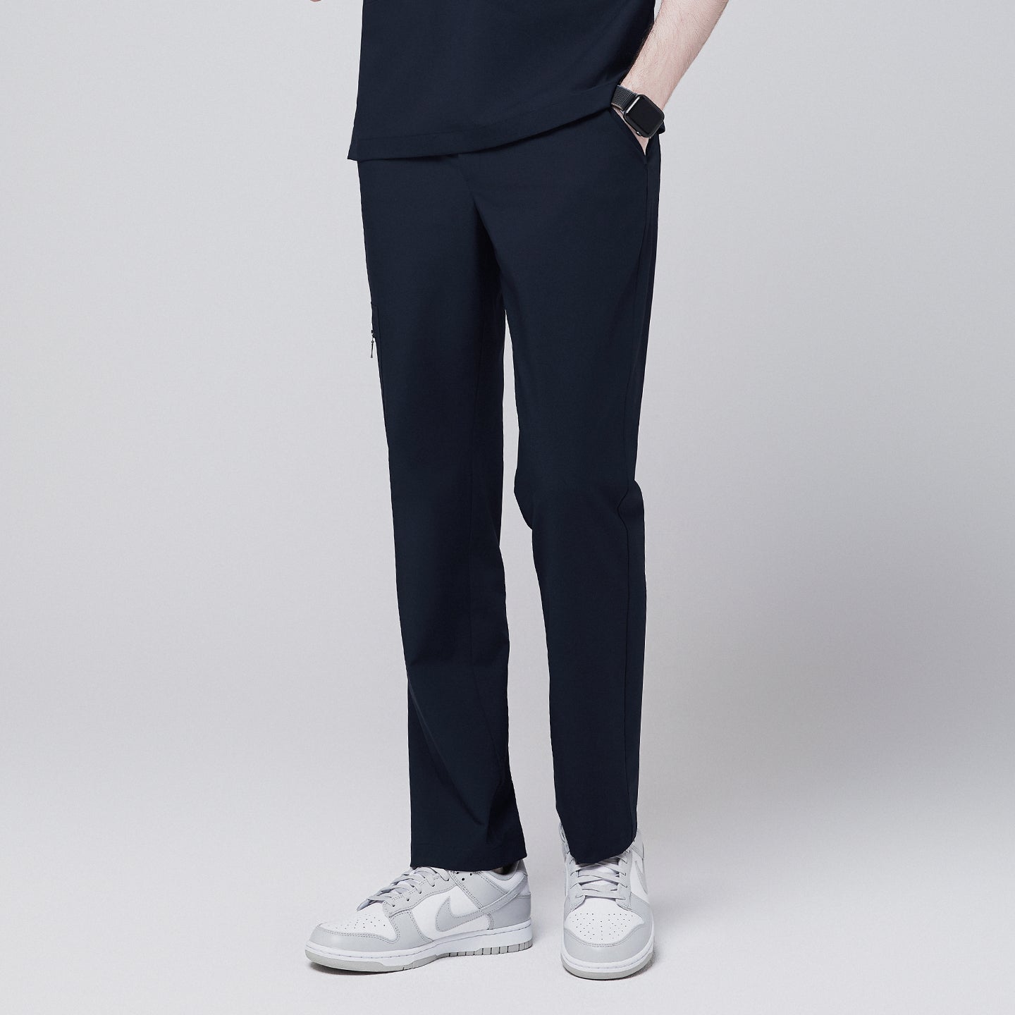 Side view of navy straight scrub pants with a zipper pocket and relaxed fit,Eco Navy