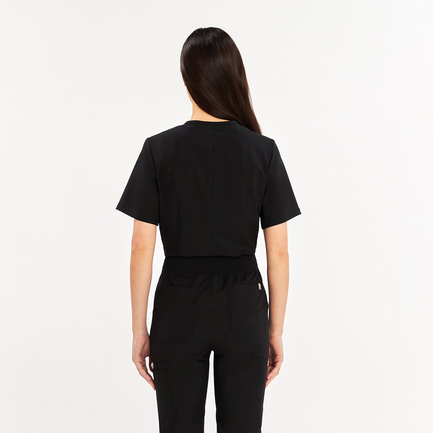 Back view of woman in black Zenir scrub top and matching pants,Eco Black