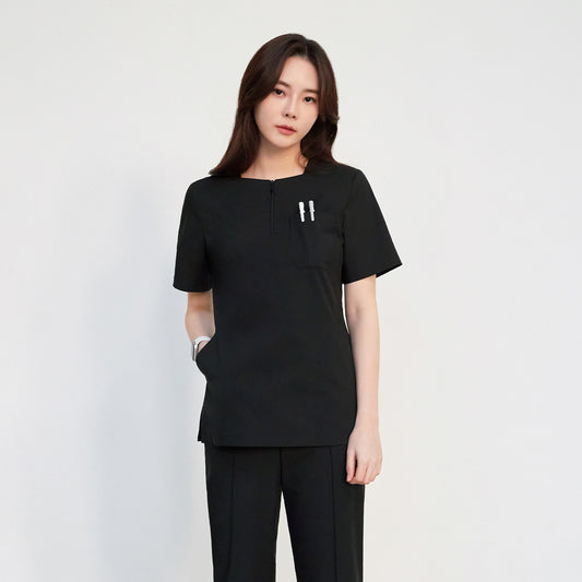 Zenir Face Zipper Scrub Top on a woman with short sleeves and three pockets,Black