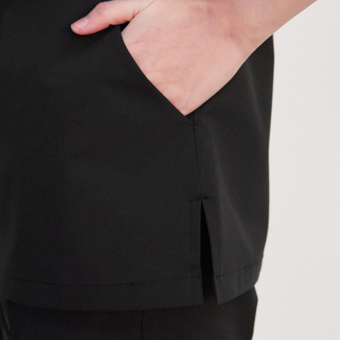 Front view of Zenir Face Zipper Scrub Top with three pockets,Black