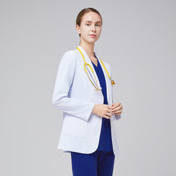 Image of A woman wearing a short white lab coat (LCW-02) over an Admiral Blue Double Pocket Scrub Top and Admiral Blue StretchFit Jogger Scrub Pants, looking straight ahead while holding a yellow stethoscope,White