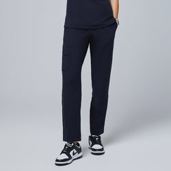 Image of Navy utility scrub pants with a functional side pocket and a sleek fit, paired with black-and-white sneakers,Midnight Navy