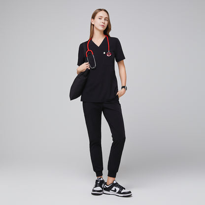 Medical professional wearing jogger-style scrub pants with a stethoscope and carrying a bag,Midnight Black