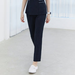 Image of Woman wearing navy side-banding scrub pants paired with a matching top and white shoes,Mir Navy