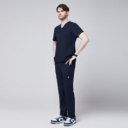 Image of Close-up of Zenir navy 8-pocket straight scrub pants paired with blue and white sneakers,Navy