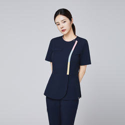 Image of Navy scrub top with gradient front zipper detail and a tailored fit, modeled by a woman in a professional pose,Navy